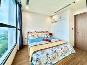 a bedroom with a bed and a large window at Cozy Skyline Escape 2Bedroom Near Hanoi Major Business District in Hanoi +27 photos