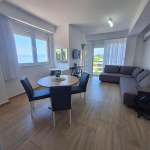 a living room with a table and a couch at Apartments Lakeside Elesec in Ohrid