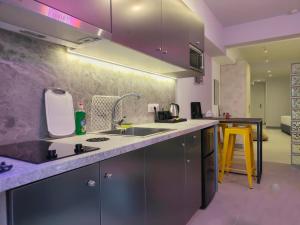 a kitchen with a sink and a counter top at CORFU INDUSTRIAL Studios in Corfu
