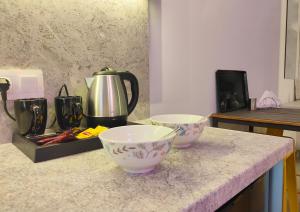 a kitchen counter with two bowls on top of it at CORFU INDUSTRIAL Studios in Corfu