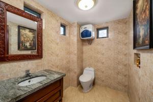 a bathroom with a toilet and a sink and a mirror at Vina Classic Hotel in Hue +38 photos