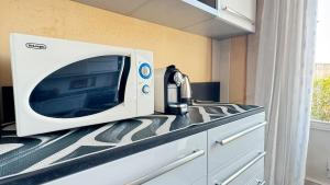 a microwave sitting on top of a counter at I mille Tramonti di Ilaria in Livorno