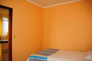 Postel nebo postele na pokoji v ubytování Hostal Duncan