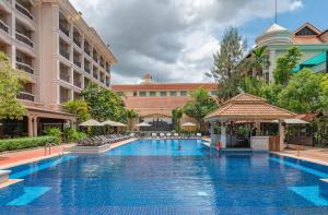 a large swimming pool in front of a building at Hotel Somadevi Angkor Resort & Spa in Siem Reap