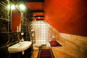 a bathroom with a sink and a toilet at Nostalgia in Sokolniki