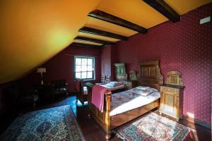 a bedroom with two beds and a red wall at Nostalgia in Sokolniki