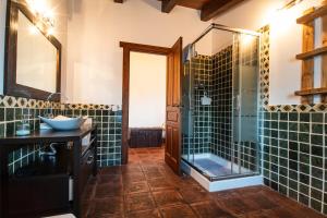 a bathroom with a glass shower and a sink at VUT Carrascosos, oasis familiar by Cabana Rentals in El Espinar +28 photos