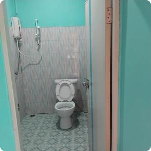a bathroom with a toilet in a shower stall at Saran Resort room 2 in Ban Khok Wat
