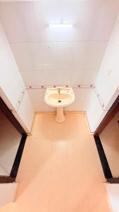 a bathroom with a toilet in the middle of a room at Winter Flys in Anaviratty +23 photos