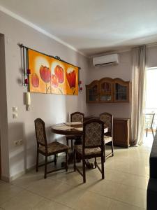 a dining room with a table and chairs at Artistic Retreat in Nafplio