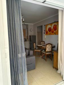 a living room with a couch and a table at Artistic Retreat in Nafplio +23 photos