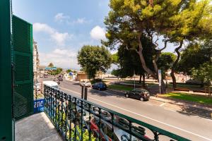 a view of a city street from a balcony at "Fiordolce" a due passi dal mare in Vado Ligure