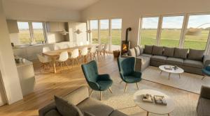 a living room with a couch and chairs and a table at Büdlfarm - Der Familien-Erlebnishof in Strandnähe in Fehmarn