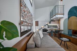 a living room with a couch and a table at Epineio Comfort Living in Litochoro
