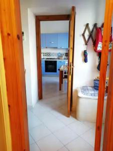 an open door to a kitchen with a stove at Casetta Calanave in Ventotene