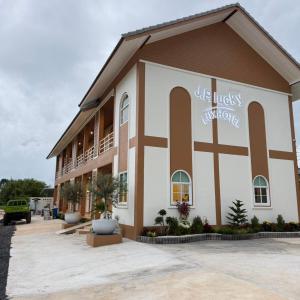 a building with the words live twists and turns on it at โรงแรม JP Lucky Lux Hotel in Ban Nong Samran