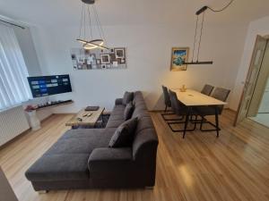 a living room with a couch and a table at Stan na dan Alisa Cazin in Cazin