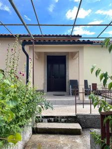 a view of a house with a patio at Frida in VeliGolji