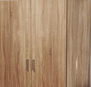 a close up of a wood paneled wall at Apartmán pro 3 osoby, Most M3 in Most +13 photos