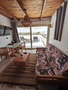 a living room with a bed and a table at Villa 22 in Dahab