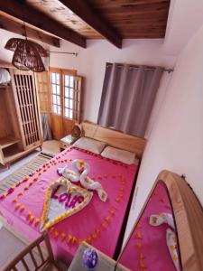 a room with a large bed with a cake on it at The Castle Hotel & studios in Dahab