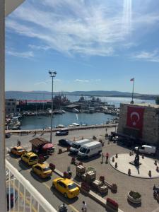 a view of a parking lot with cars and a harbor at Gelibolu Elisa Hotel in Gelibolu +24 photos