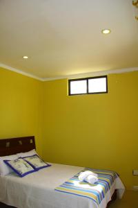 Postel nebo postele na pokoji v ubytování Hostal Duncan
