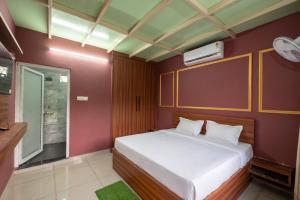 a bedroom with a large white bed in a room at Sambhariya Bagh Resort in Kānota +15 photos