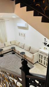 a living room with a couch and a table at فيلا in Salalah
