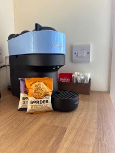 a slow cooker and some food and a box of food at Blackthorn and Rose Shepherds Huts in Scribbagh