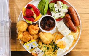 a plate of food with different types of food at Ufo Boutique Hotel in Tirana