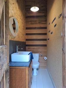 a bathroom with a sink and a toilet at Mazurska Chatka Pilchy in Pilchy +19 photos