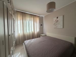 a bedroom with a bed and a large window at Apartamento Pargue Tropical in Los Cristianos +47 photos