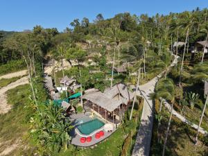 an aerial view of a resort with a swimming pool at RoomQuest THEVA Resort Residence Koh Samui in Koh Samui