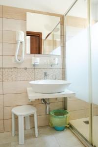 a bathroom with a sink and a mirror at Innpiero in Taormina +82 photos