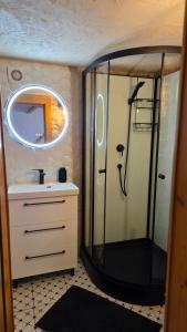 a bathroom with a shower and a sink and a mirror at Zacisze 13 in Leśna +36 photos