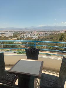 a table and chairs with a view of a city at Appart-Hotel Cabodream beach in Tétouan