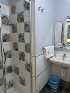 a bathroom with a shower and a sink at B&B Ponza Suite in Ponza