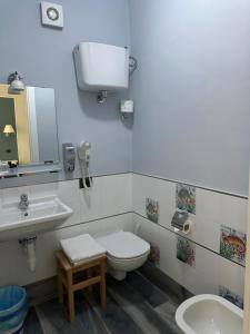 a bathroom with a toilet and a sink at B&B Ponza Suite in Ponza +9 photos