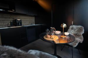 a kitchen with a table with food on it at Yllas Cabin for Work, Ski and Relax in Kolari