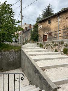 a set of concrete stairs in front of a building at Nido Stellato in Calascio
