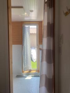 a room with a window and a shower curtain at Magical Skate Casa in Wakayama +32 photos