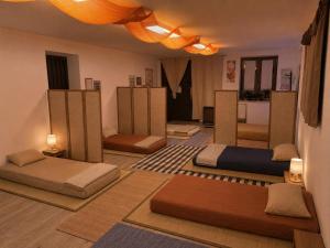 a room with several beds on the floor at Casa Yoga 2 Rilassati in una oasi di pace immersa nella natura a soli 60 minuti da Roma in Bassano Romano