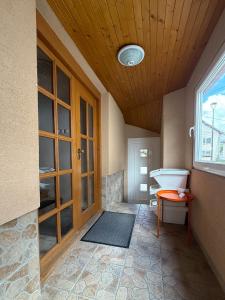 a bathroom with a tub and a sink and a window at Apartmány Hrady in Zuberec +42 photos