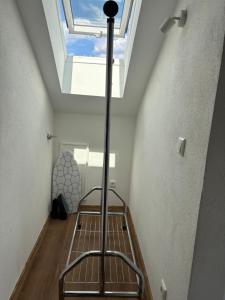 a bedroom with a skylight and a bed in a ceiling at Vilseck Stay - Studio Suite in Vilseck
