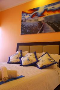 Postel nebo postele na pokoji v ubytování Hostal Duncan