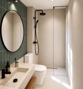 a bathroom with a shower and a toilet and a sink at athanasian side sea view home in Polychrono +7 photos