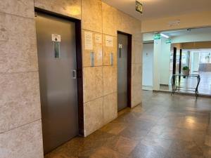 a hallway of an office with doors and a table at Brisamar Suite Hotel in Florianópolis