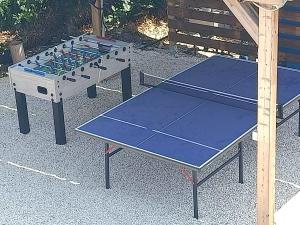 two ping pong tables are sitting on the ground at Villa Antonina 2 in Crecchio