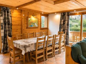 a dining room with a table and chairs at Les Dolomites in La Plagne Tarentaise
